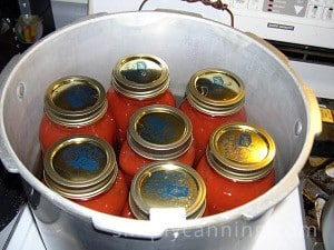 Seven jars of spaghetti sauce in a pressure canner.