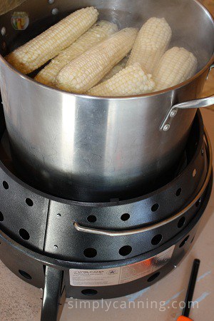 Blanching corn over the Volcano Grill.