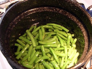 A large pot full of blanched green beans.