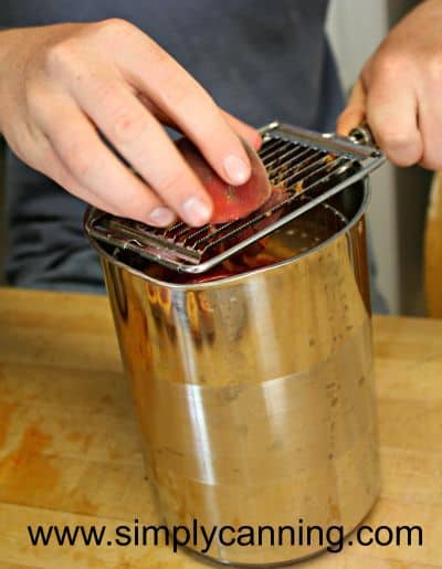 Slicing fresh peaches into the 4th burner pot.