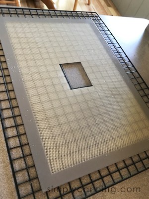 A dehydrator tray lined with a dehydrator sheet.