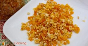 Dried corn kernels on a white plate.