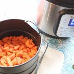 chopped carrots beside an instant pot