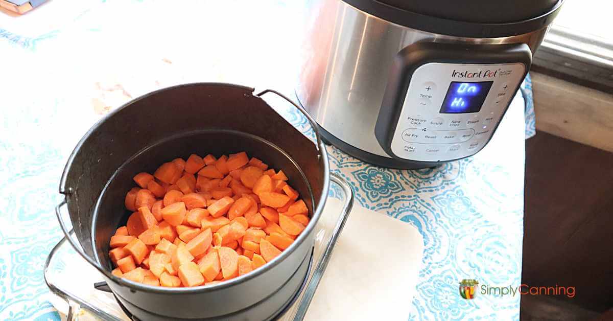 chopped carrots beside an instant pot