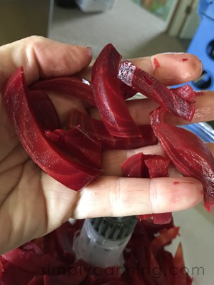 A handful of beets sliced into sticks.