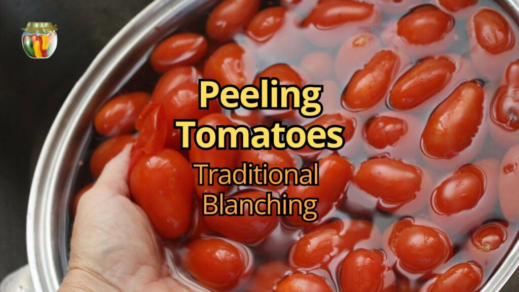 A handful of fresh tomatoes chilling in cold water, with the skins splitting off the tomatoes.