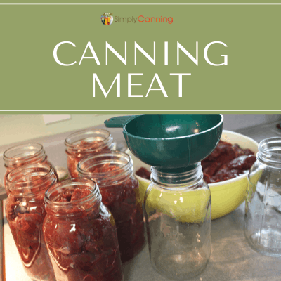 Filling jars with raw meat pieces.