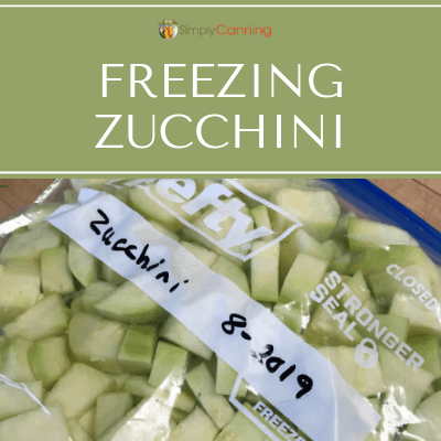 Peeled and chunked zucchini packed into a labeled freezer bag.