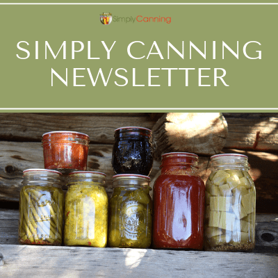 Jars filled with home canned food like vegetables and pickles.