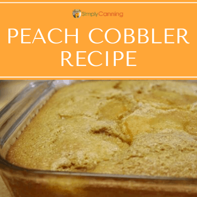 Peach cobbler with a golden brown crust and fruit just visible on the surface.