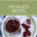 An open jar of deep red pickled beets with pickled beet pieces on the side.