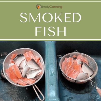 Fish pieces draining in strainers placed in the sink.