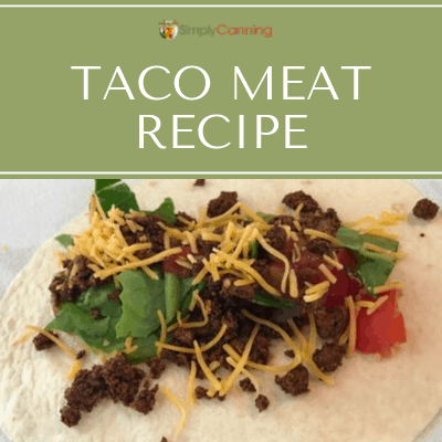 Taco meat sprinkled with cheese and other toppings on a flour tortilla.