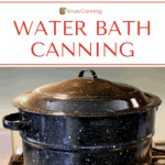 A graniteware water bath canner sitting on the stovetop.