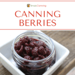 A jar filled with canned berries.