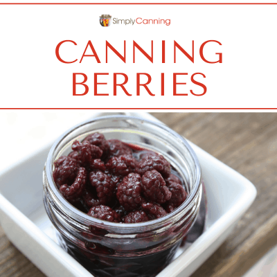 A jar filled with canned berries.
