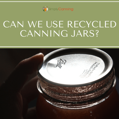 Holding a sealed canning jar with a flat Ball lid sealed on top of it.