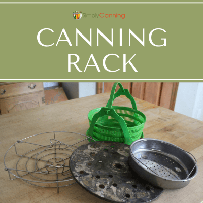 Various metal and silicone canning racks piled on the countertop.