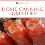 Quart jars filled with juicy tomatoes.