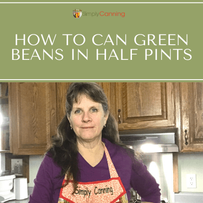 Sharon wearing a Simply Canning apron while standing in her kitchen.