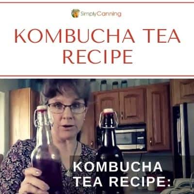 Sharon holding a bottle of kombucha.