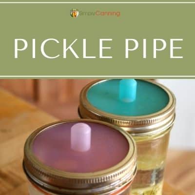 Pickle Pipes screwed onto canning jars.