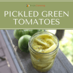 An open jar of pickled green tomatoes with whole green tomatoes in the background.