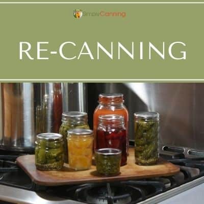 Bright jars of home canned food sitting next to the canner.