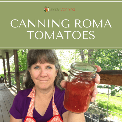 Sharon holding a small jar of canned tomatoes.