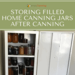 An open metal cupboard filled with jars of home canned food.