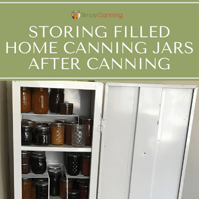 An open metal cupboard filled with jars of home canned food.