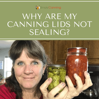 Sharon holding two jars of home canned food.