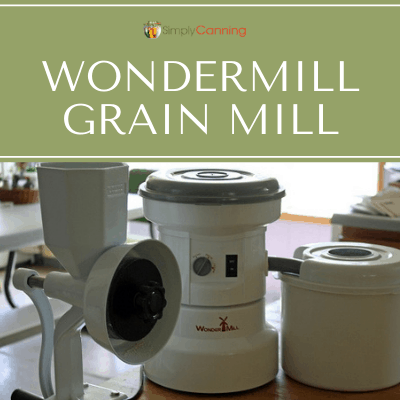 Two different types of grain mills sitting beside each other on the countertop.