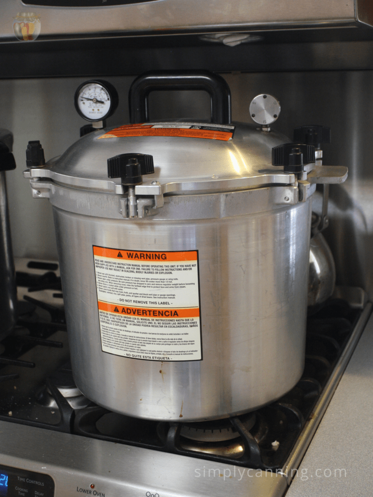 The All American Canner sitting on the stovetop.