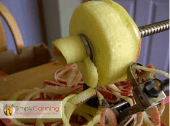 Peeling and slicing the apple using the apple slicer tool.