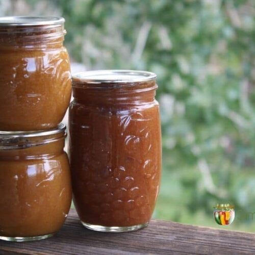 Three jars filled with homemade apricot butter.