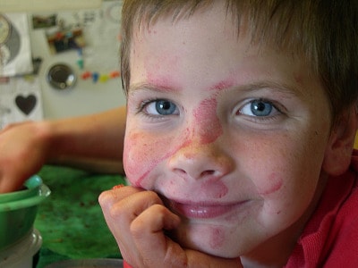 One of Sharon's smiling sons with cherry juice all over his face.