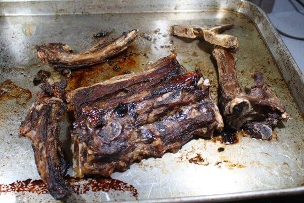 Roasted beef on a cookie sheet.