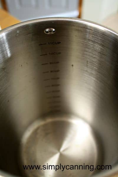 Measuring marks shown inside the 4th burner pot.