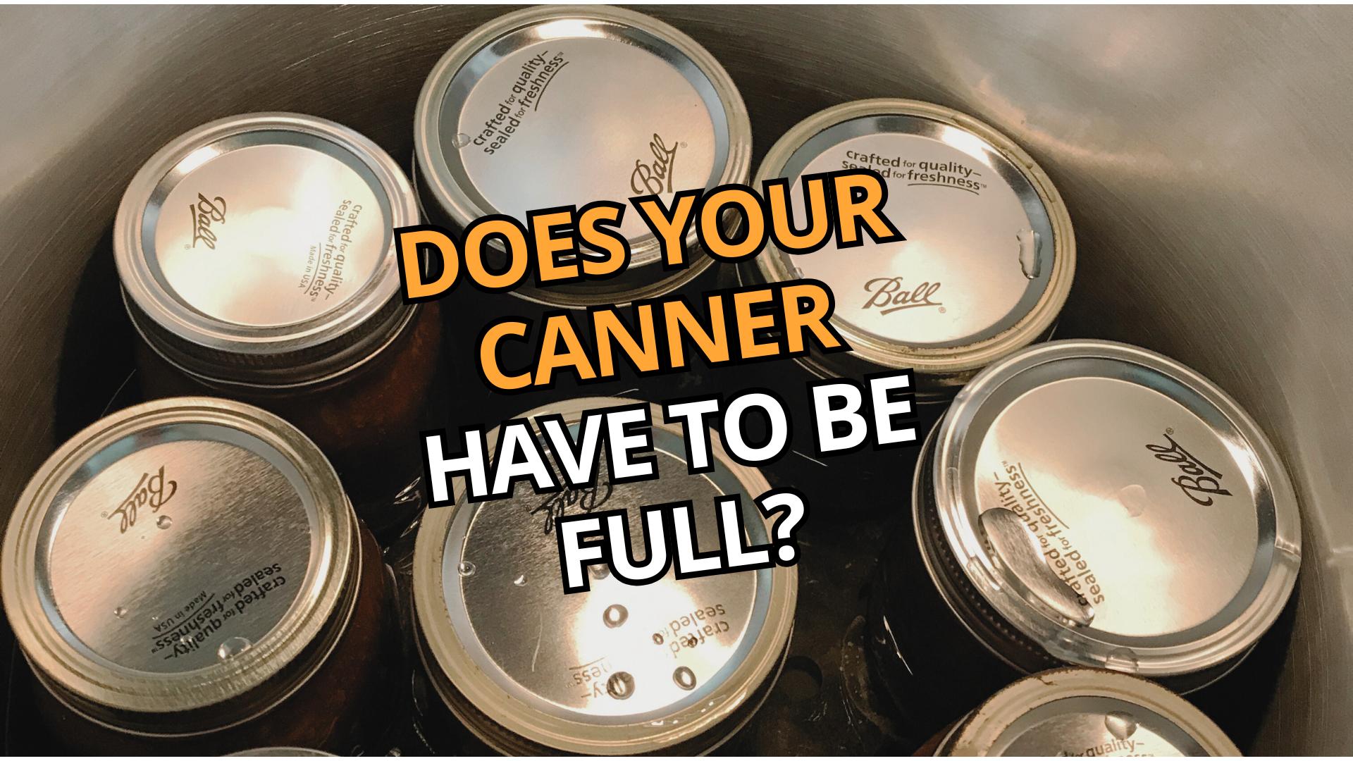 Close up image of jars in a pressure canner with the text 'Does Your Canner Have To Be Full?