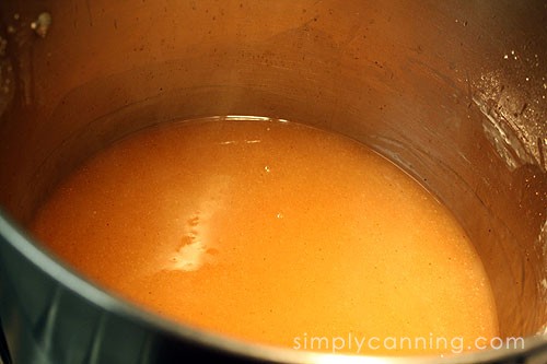 Heating up the thickener or syrup in a pot.