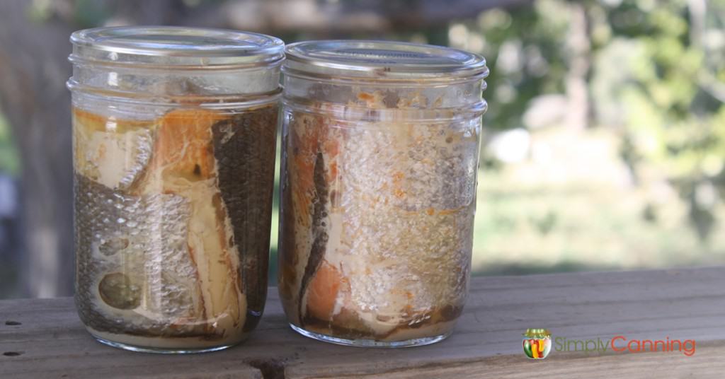 Jars filled with home canned fish.