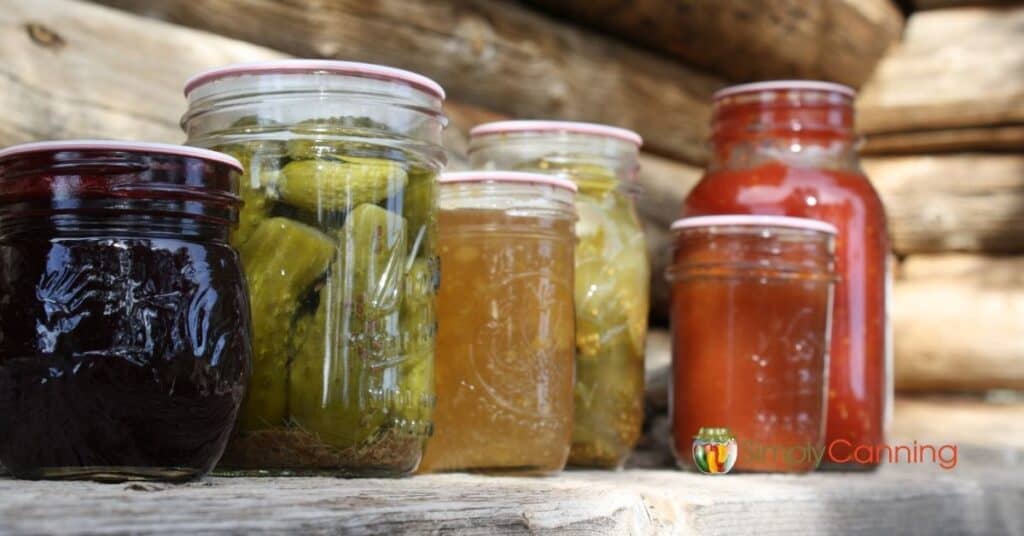 Jars of colorful home canned food.