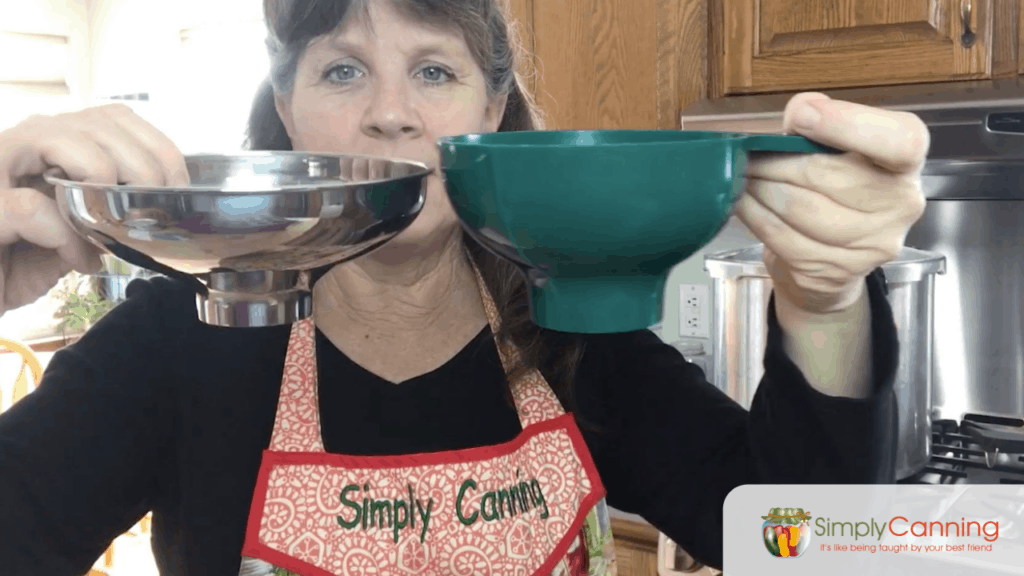 Sharon comparing plastic canning funnel and stainless steel funnel.