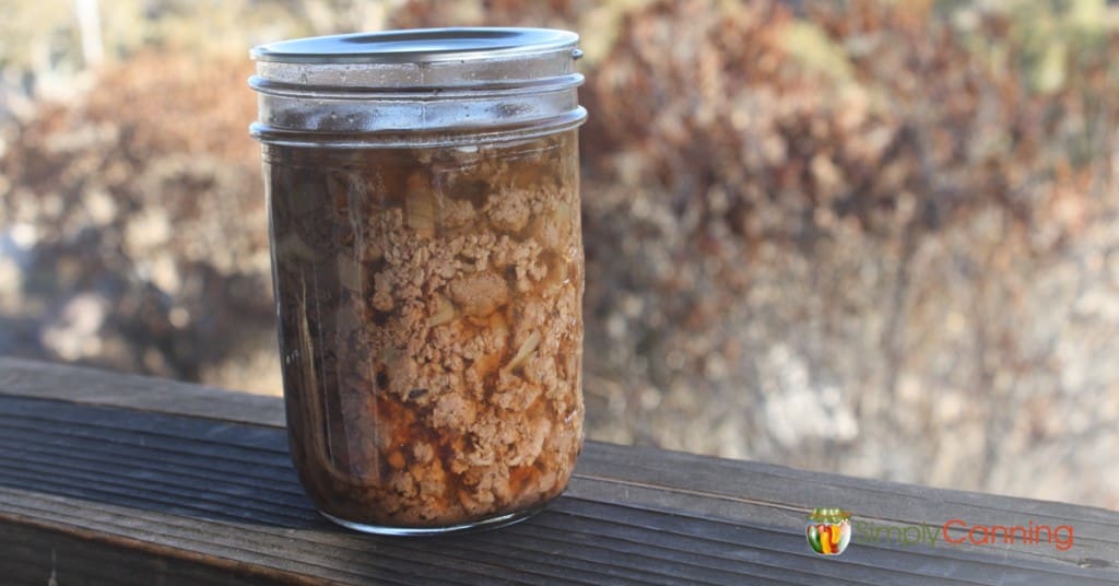 A small jar of canned ground meat pieces.