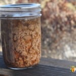 A small jar of canned ground meat pieces.