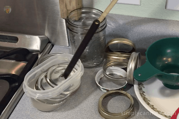 Rings and flat lids spread out on the countertop.