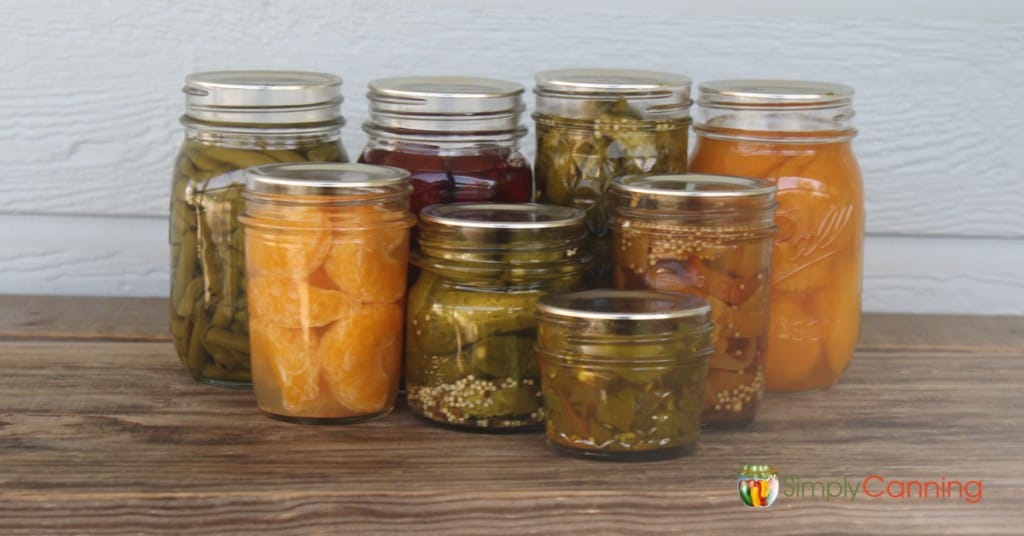 Filled canning jars in various colors and sizes.