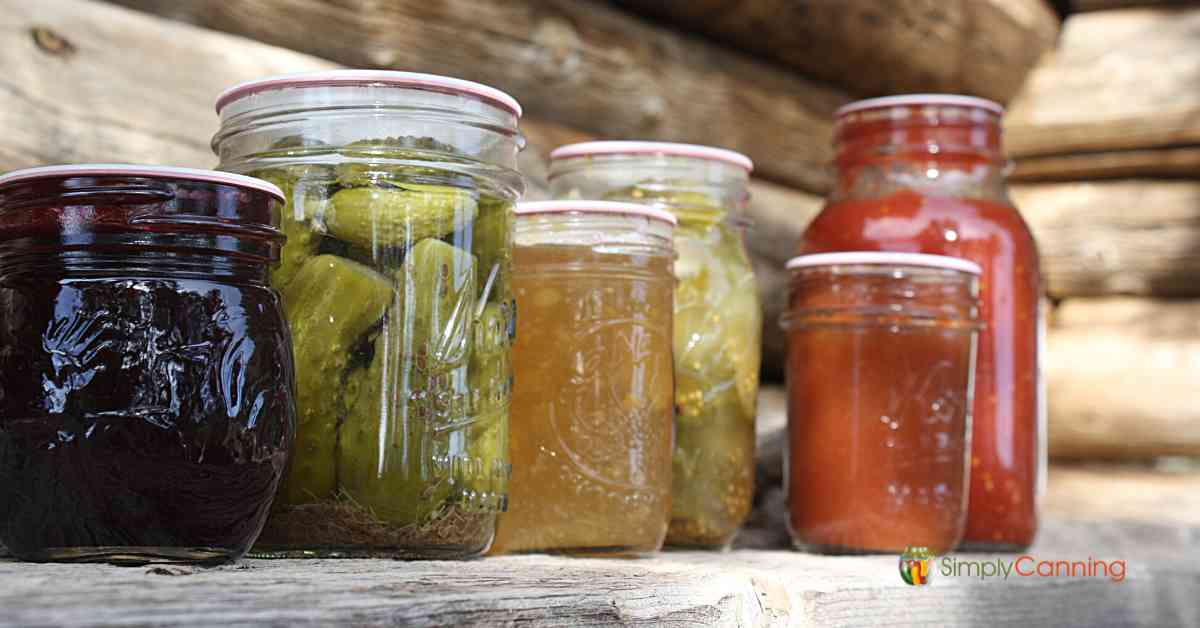 canning jars on wood background