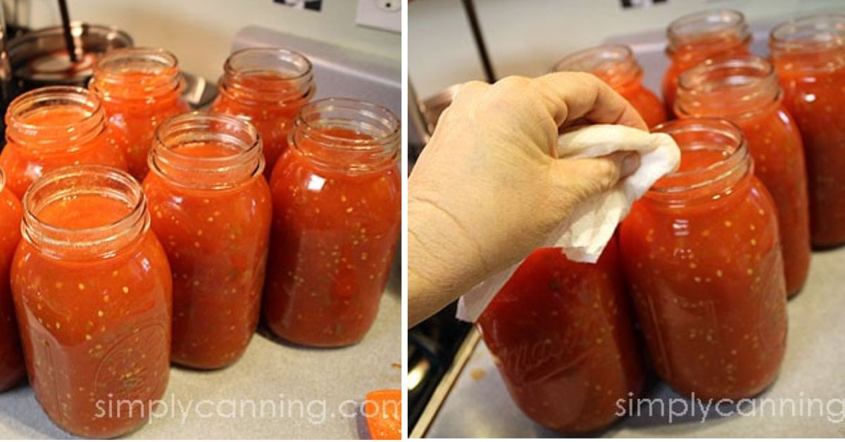 Filling quart jars and wiping the rims of stewed tomatoes.